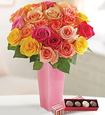 multicolored roses in vibrant pink vase